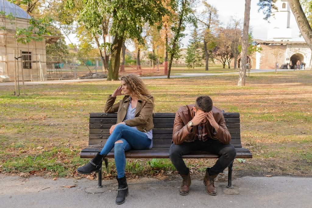 A Couple sitting in disagreement.