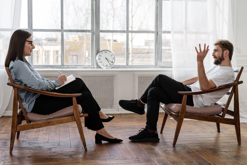 Person sitting in therapy.