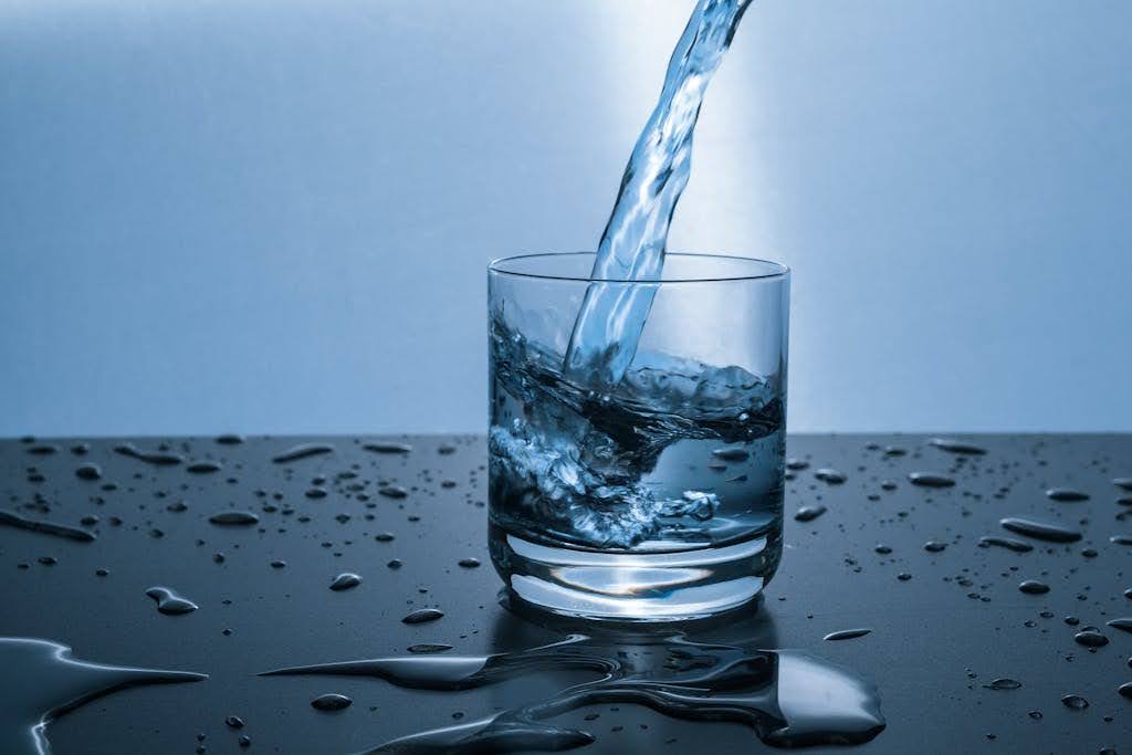 Water pouring in a glass