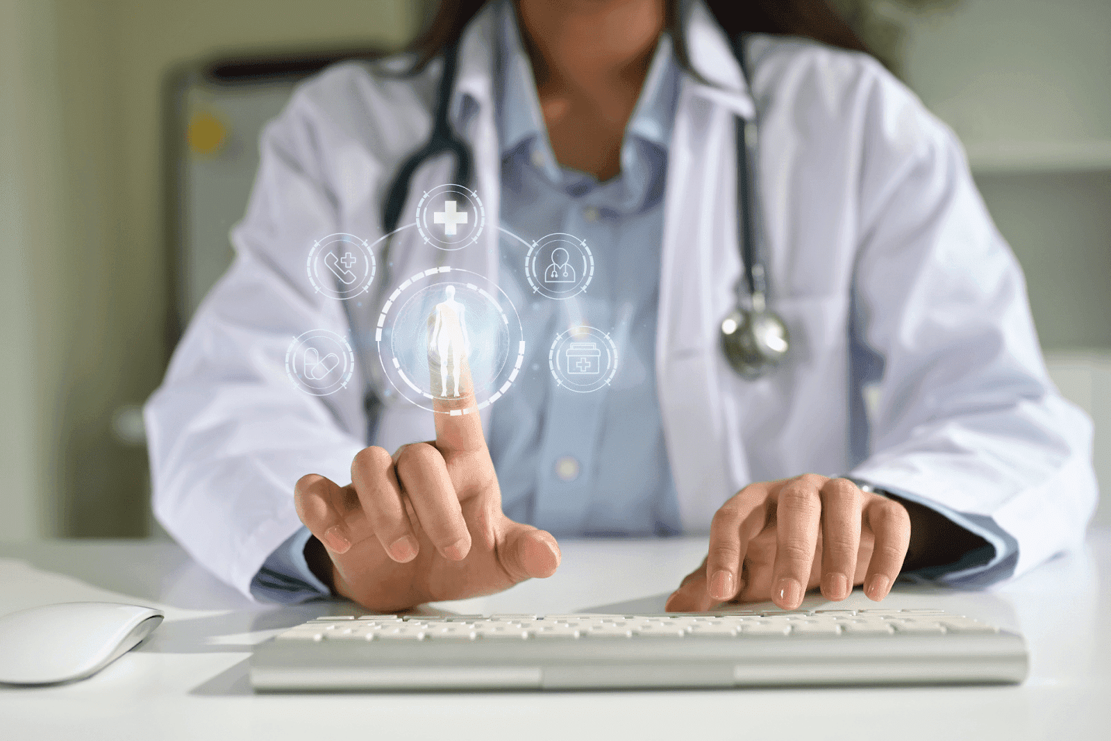 A doctor uses a computer while touching a virtual hologram displaying medical icons and a human figure.