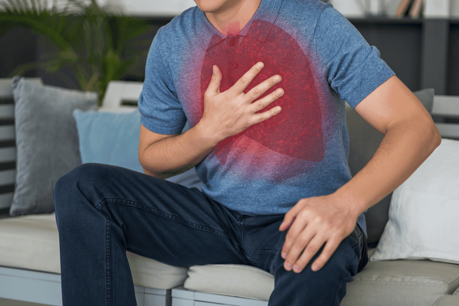 A man clutching his chest with a red lung graphic overlay, indicating chest pain or breathing issues.