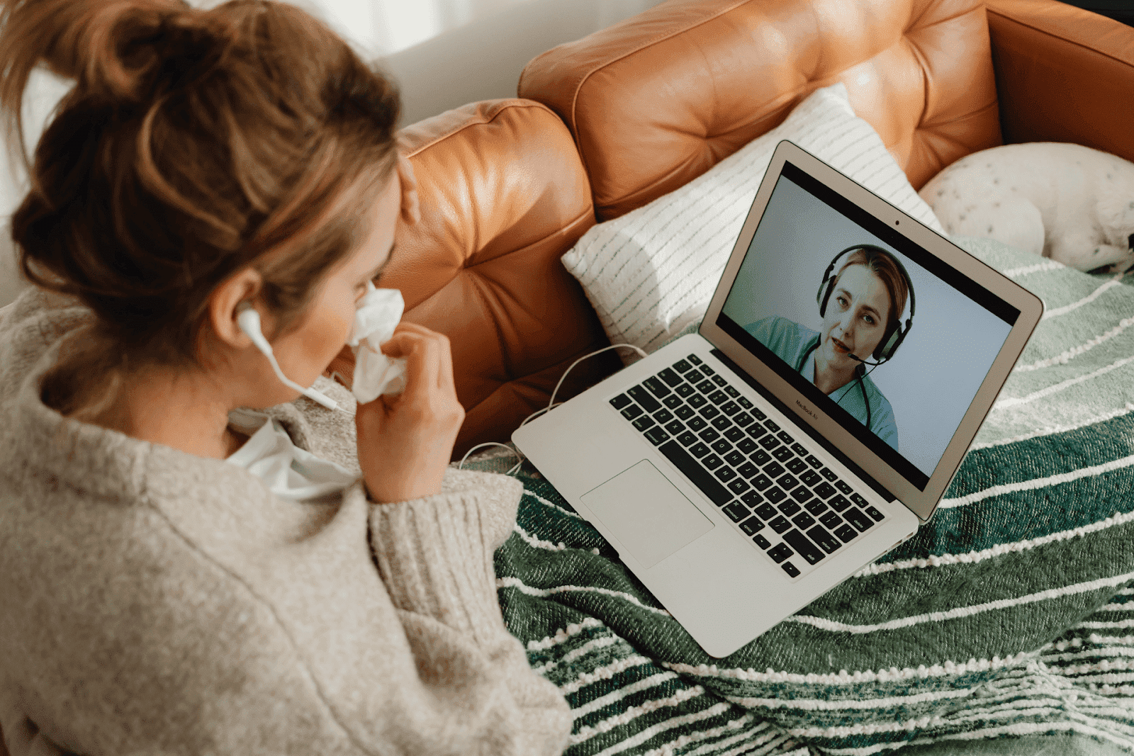A sick woman in a video call with a doctor