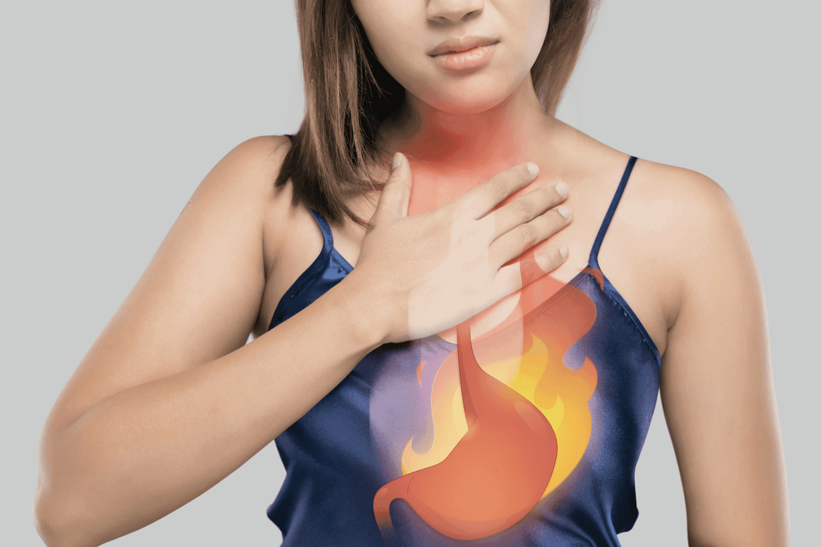 A woman places her hand on her chest with an illustrated burning sensation and stomach overlay, indicating heartburn or acid reflux symptoms.