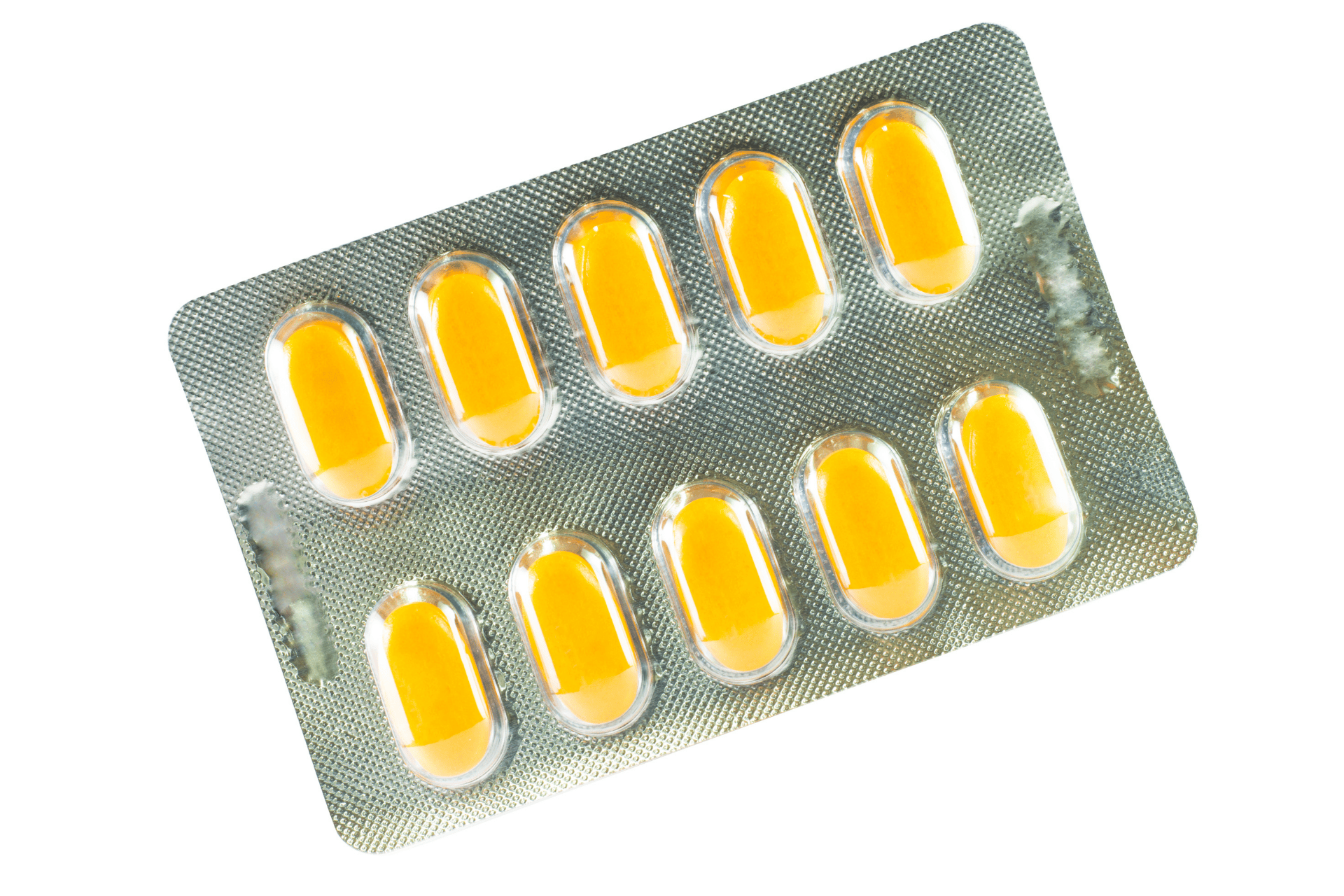 Blister pack of yellow capsules on a white background