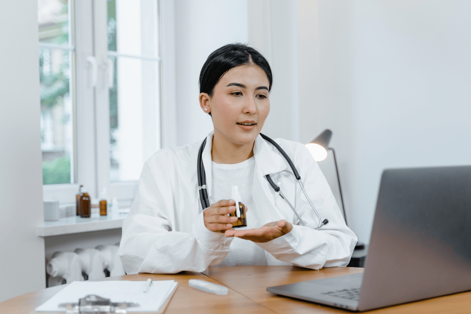 Doctor explaining medication during an online consultation.