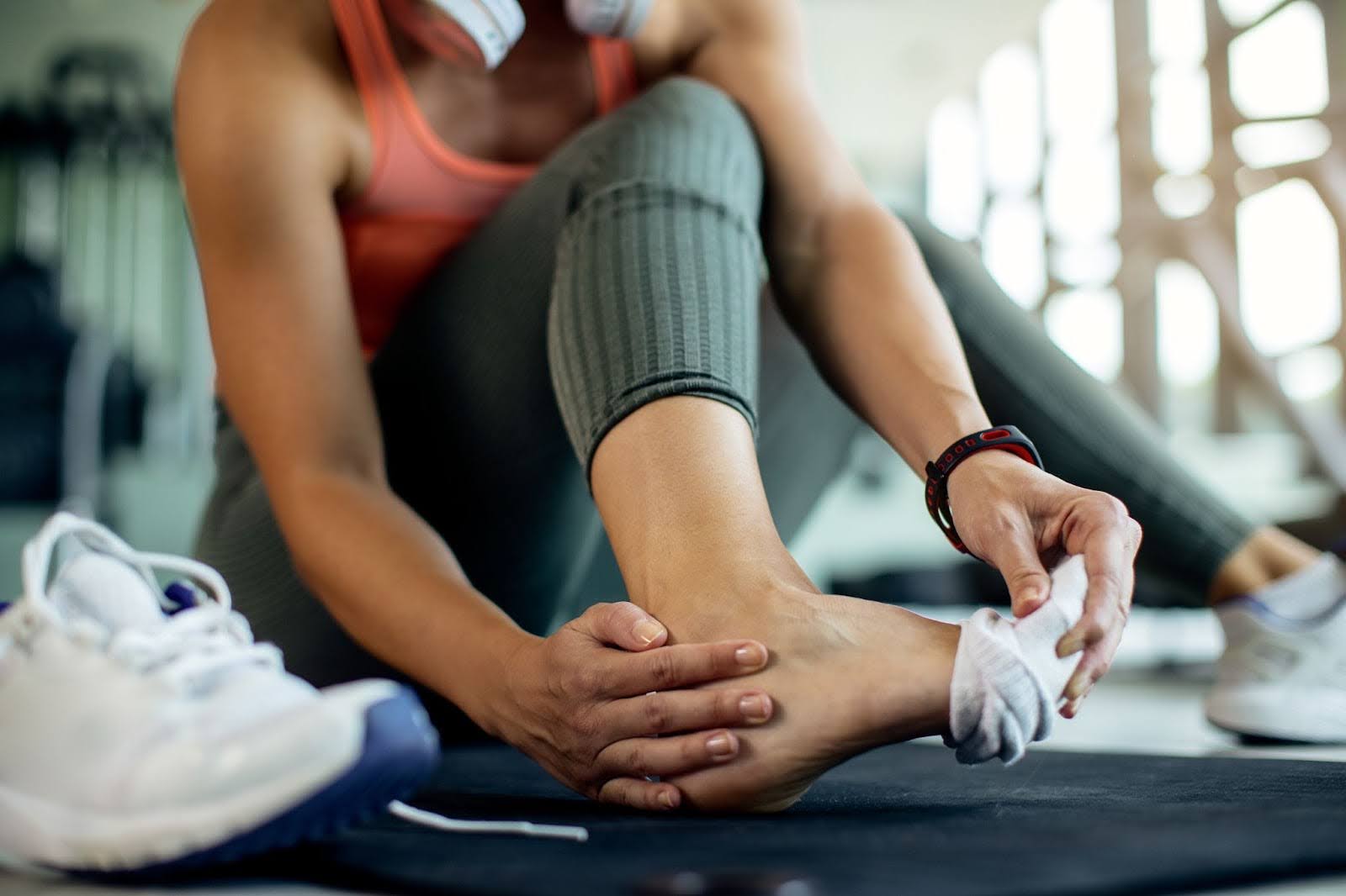 A woman rubbing her foot