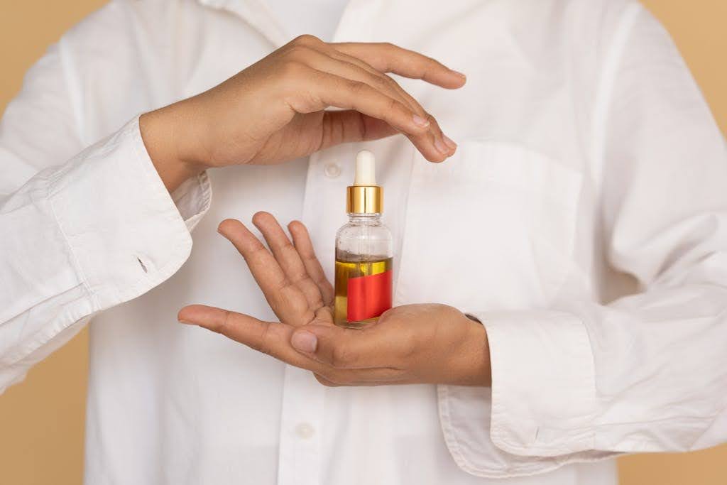 Person holding a serum.