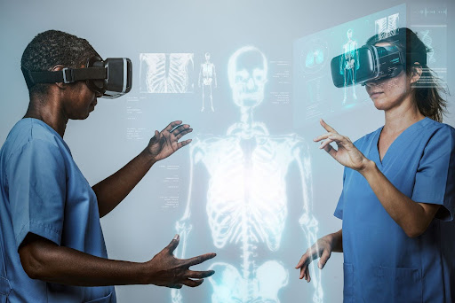 Doctors working on a skeleton hologram