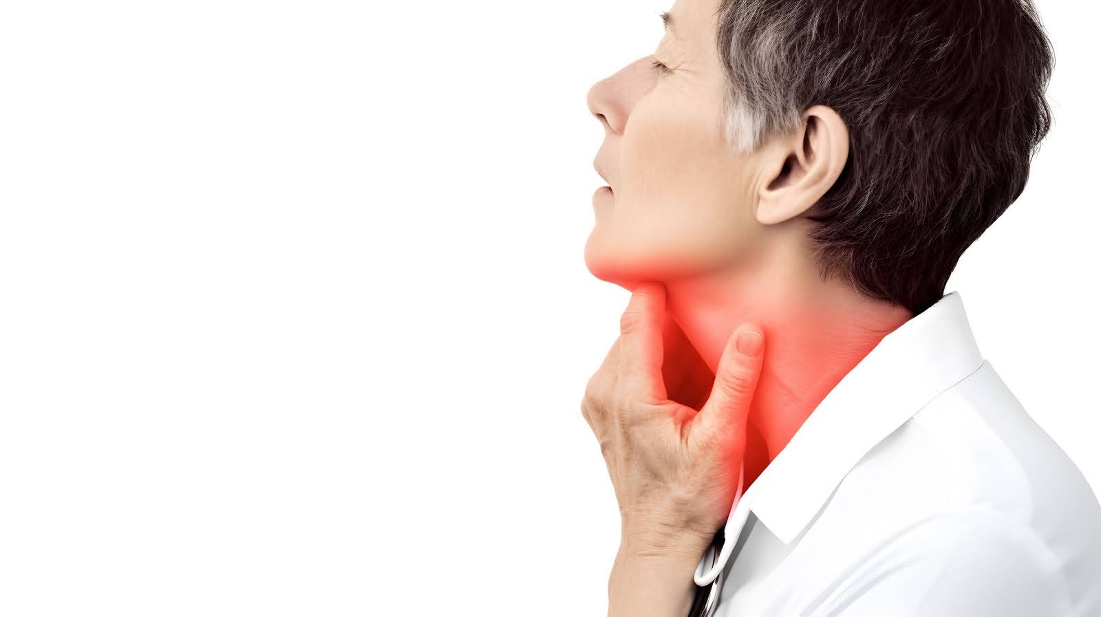 Man experiencing throat pain