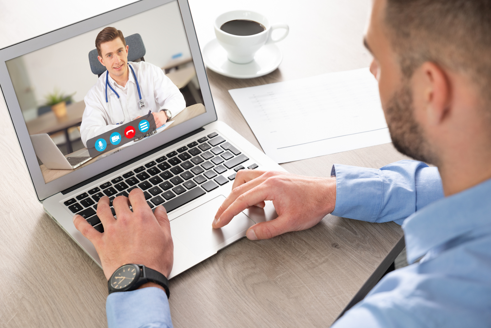 Man having a video consultation with a doctor on his laptop.