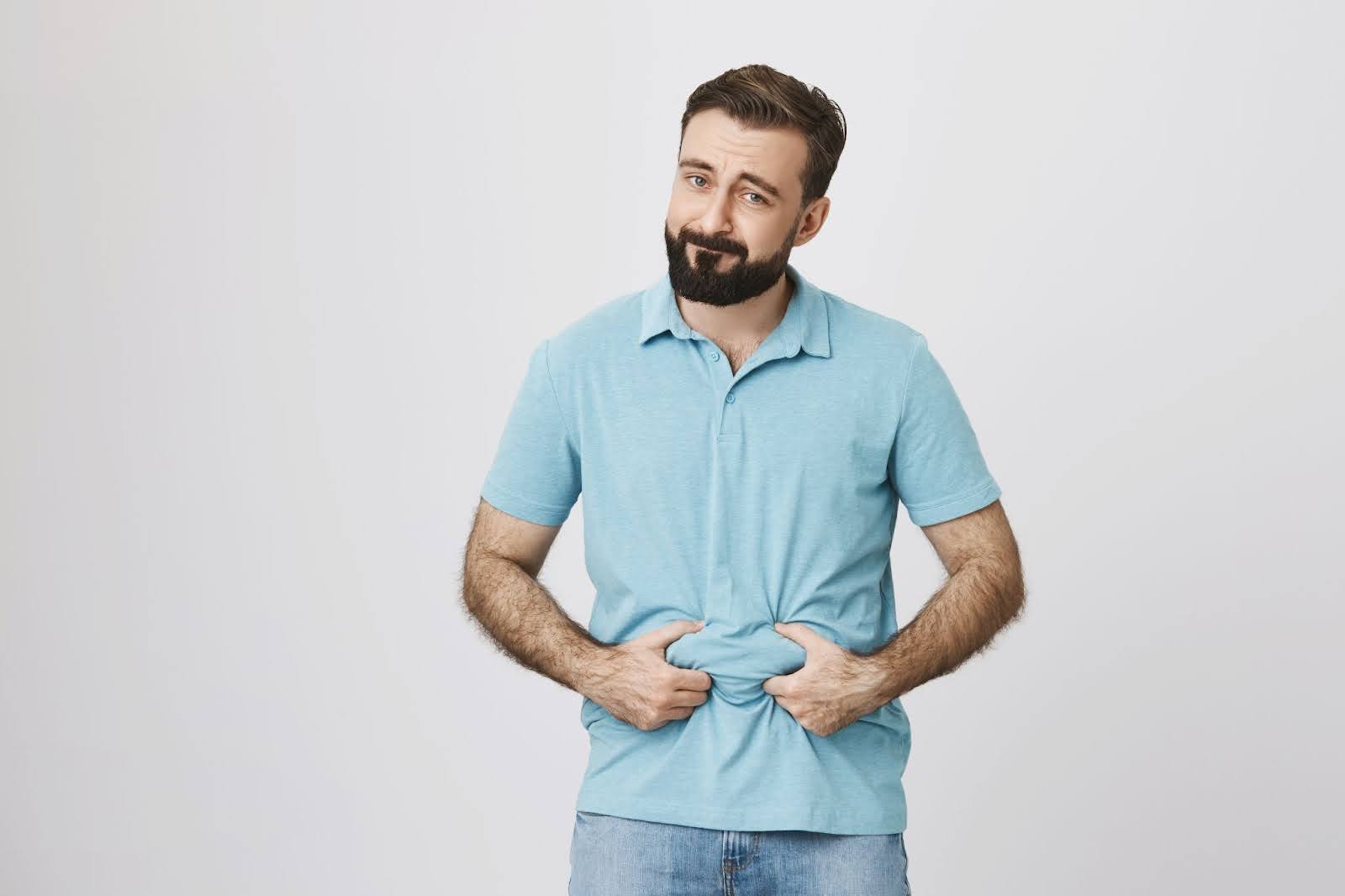 Guy showing belly fat