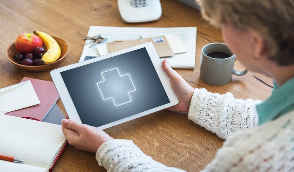 Female patient using a tablet for an online health consultation