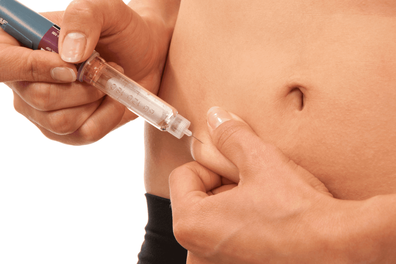 Person administering an injection into the skin of their abdomen.