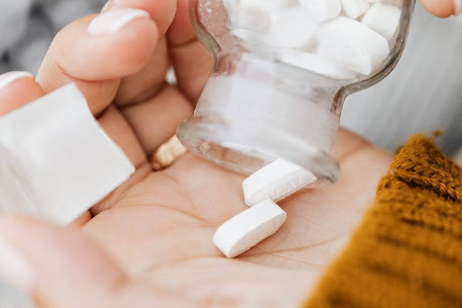 White pills in a bottle.
