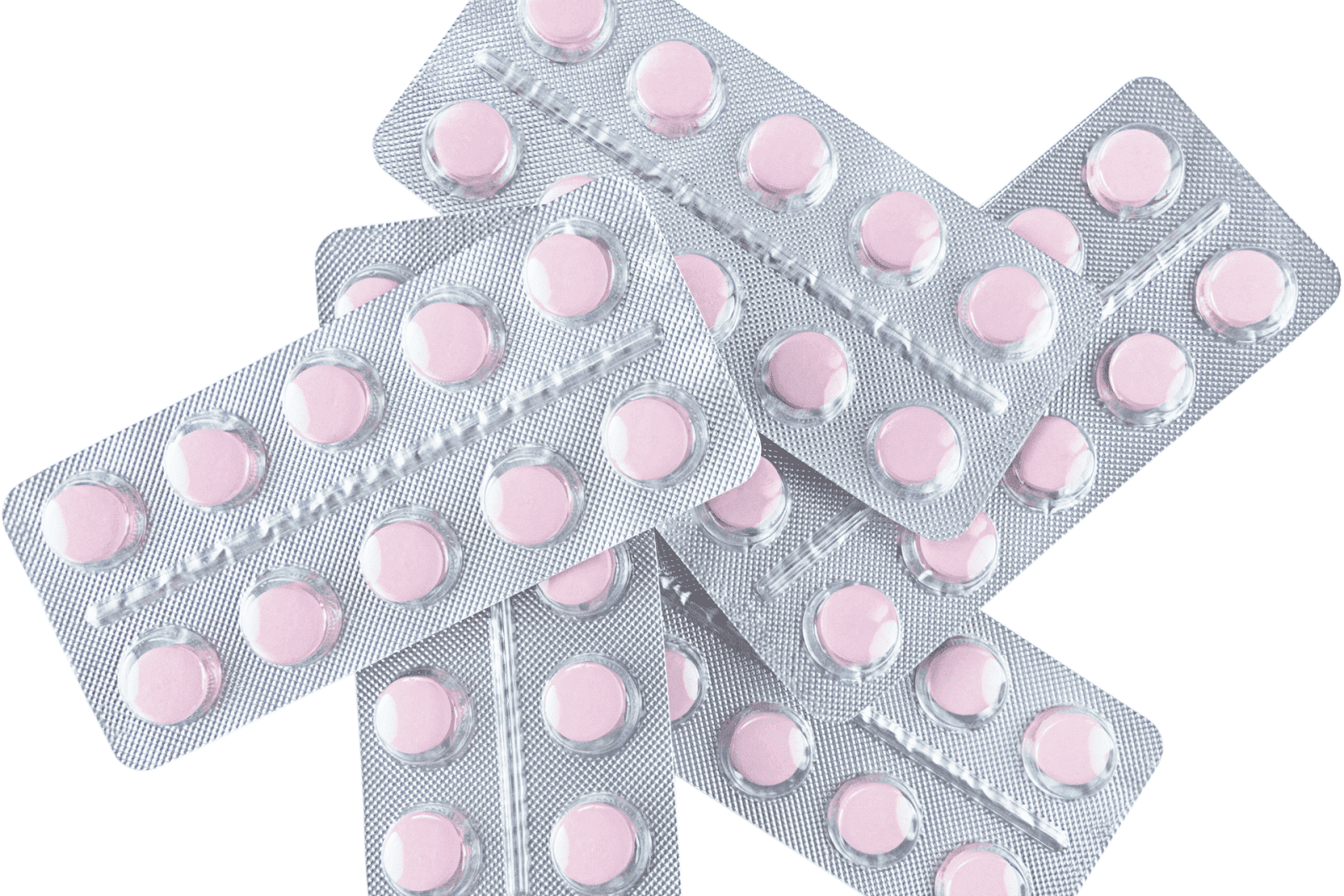 Stacks of blister packs filled with round pink tablets