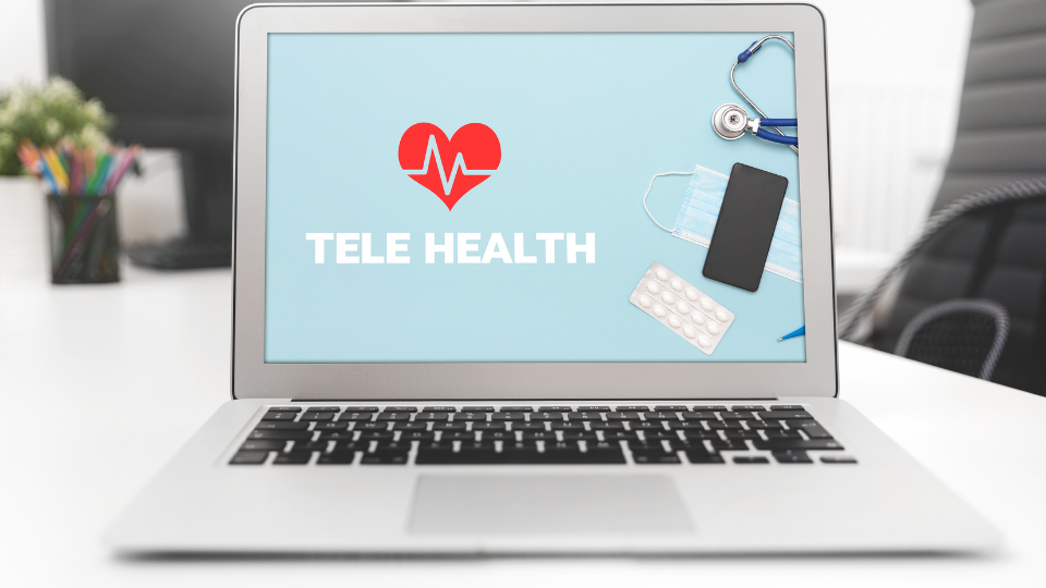 Laptop showing "Tele Health" image on screen