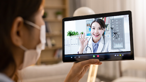 Person with mask on a video call with doctor