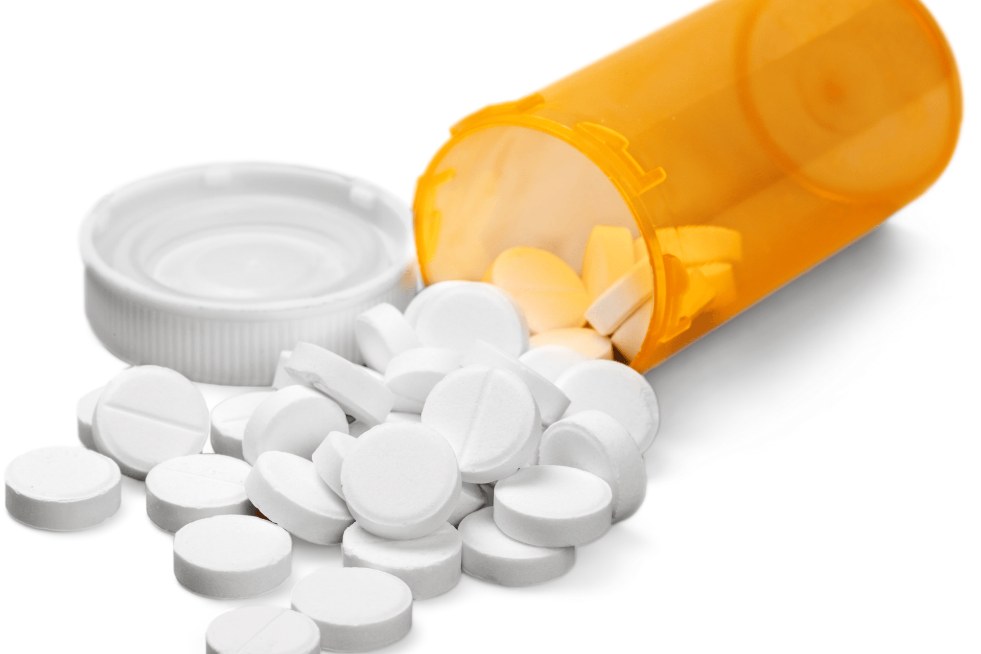 Spilled orange prescription bottle with white tablets on a surface.