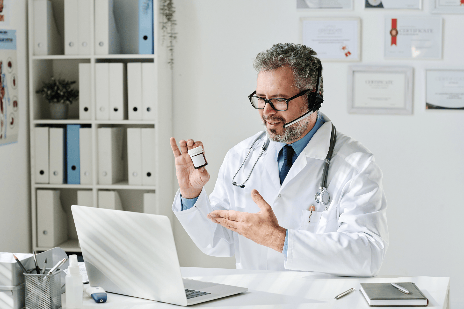 Doctor on a video call holding up a bottle of antidepressant medication.
