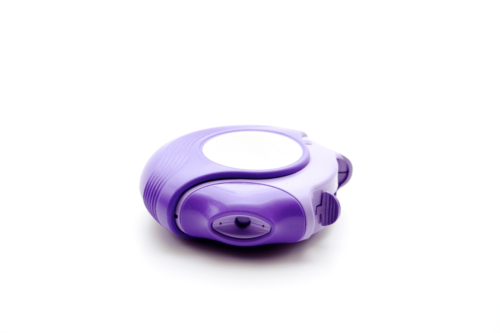 Purple dry powder inhaler device on a white background.