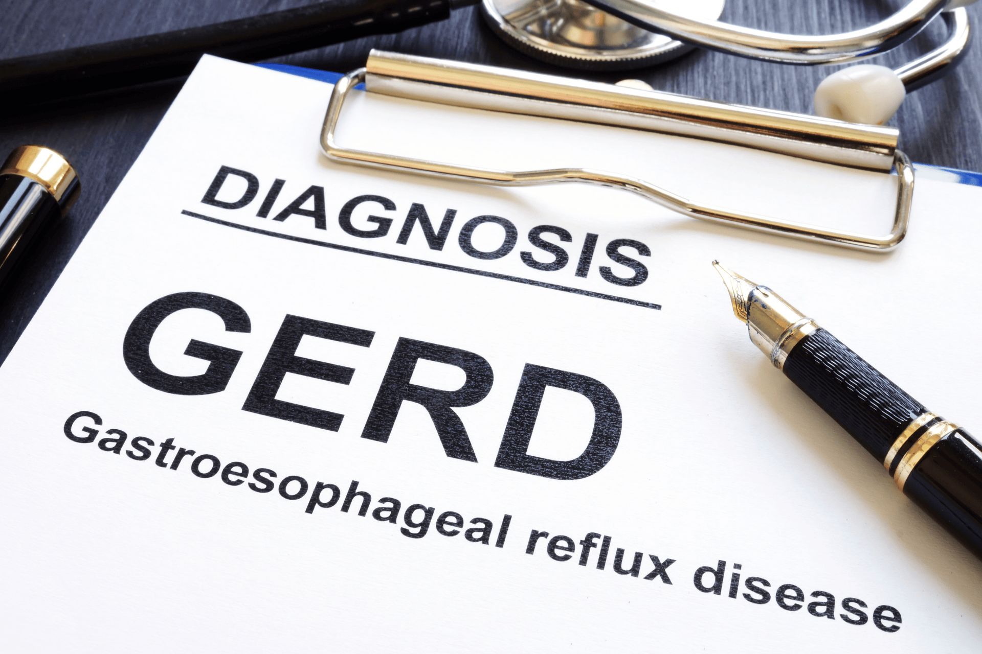 Clipboard showing a GERD (gastroesophageal reflux disease) diagnosis.