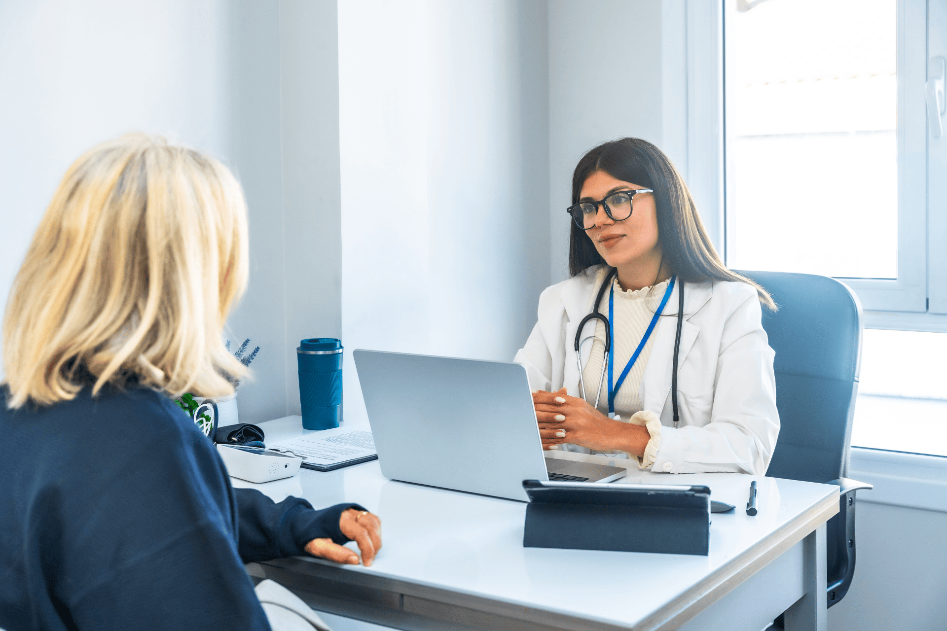 A doctor explaining diabetes treatment options to a patient during a clinic consultation.