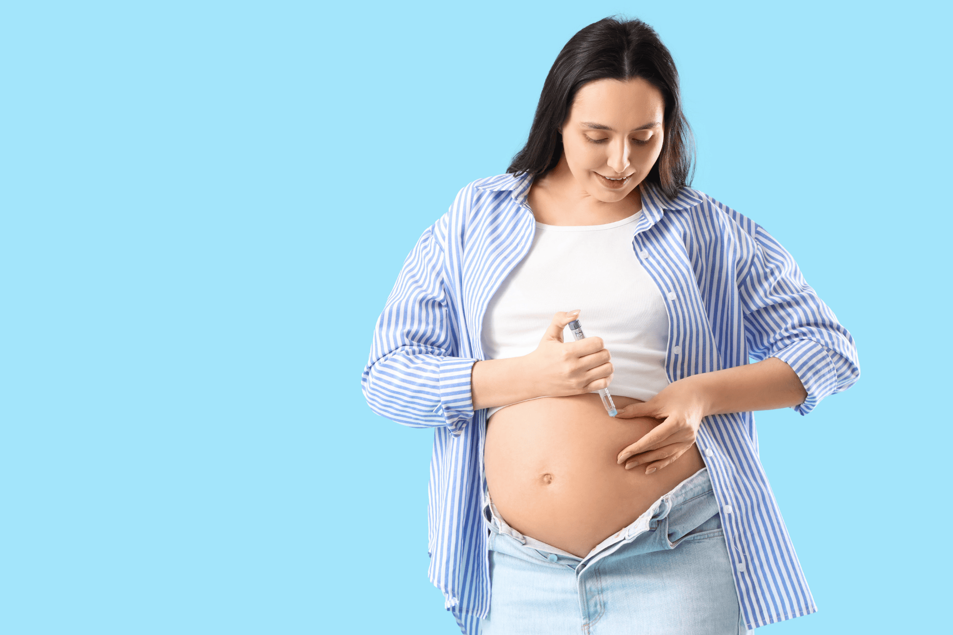 Pregnant woman administering an insulin injection to manage gestational diabetes.