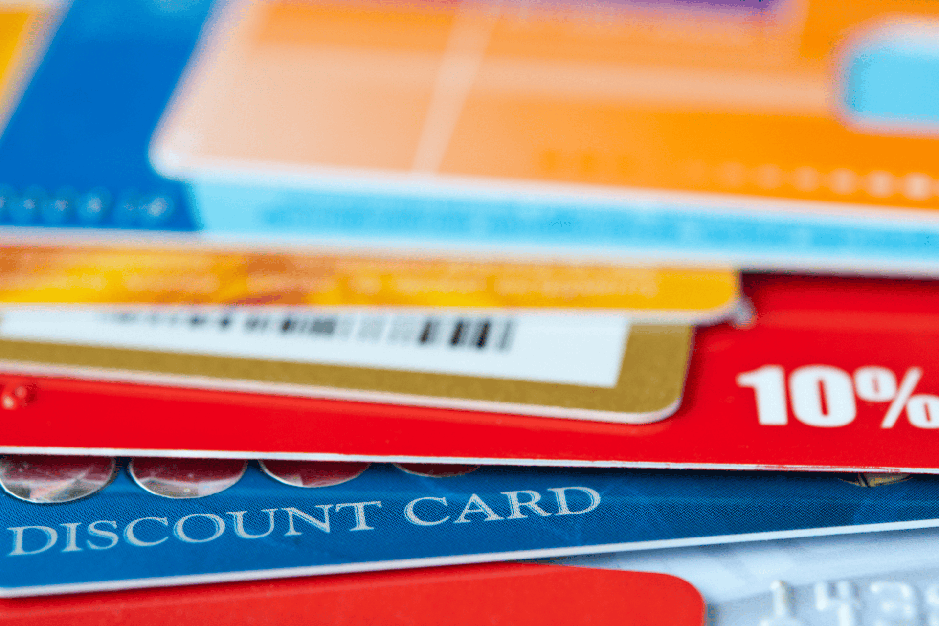 Stack of discount and payment cards, representing savings or assistance for diabetes-related expenses.