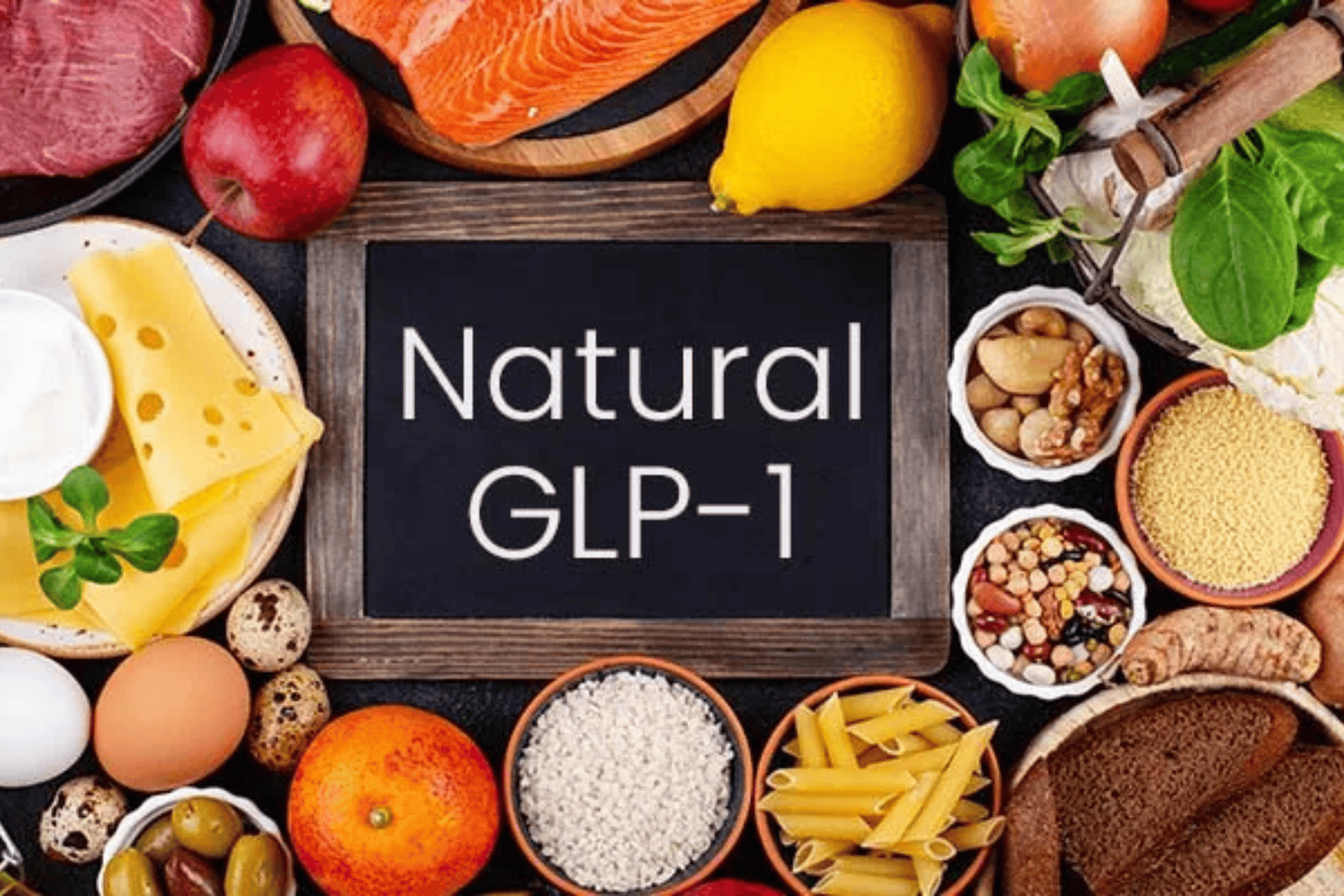 Chalkboard reading “Natural GLP-1” surrounded by assorted whole foods like fish, fruit, grains, nuts, eggs, and vegetables.