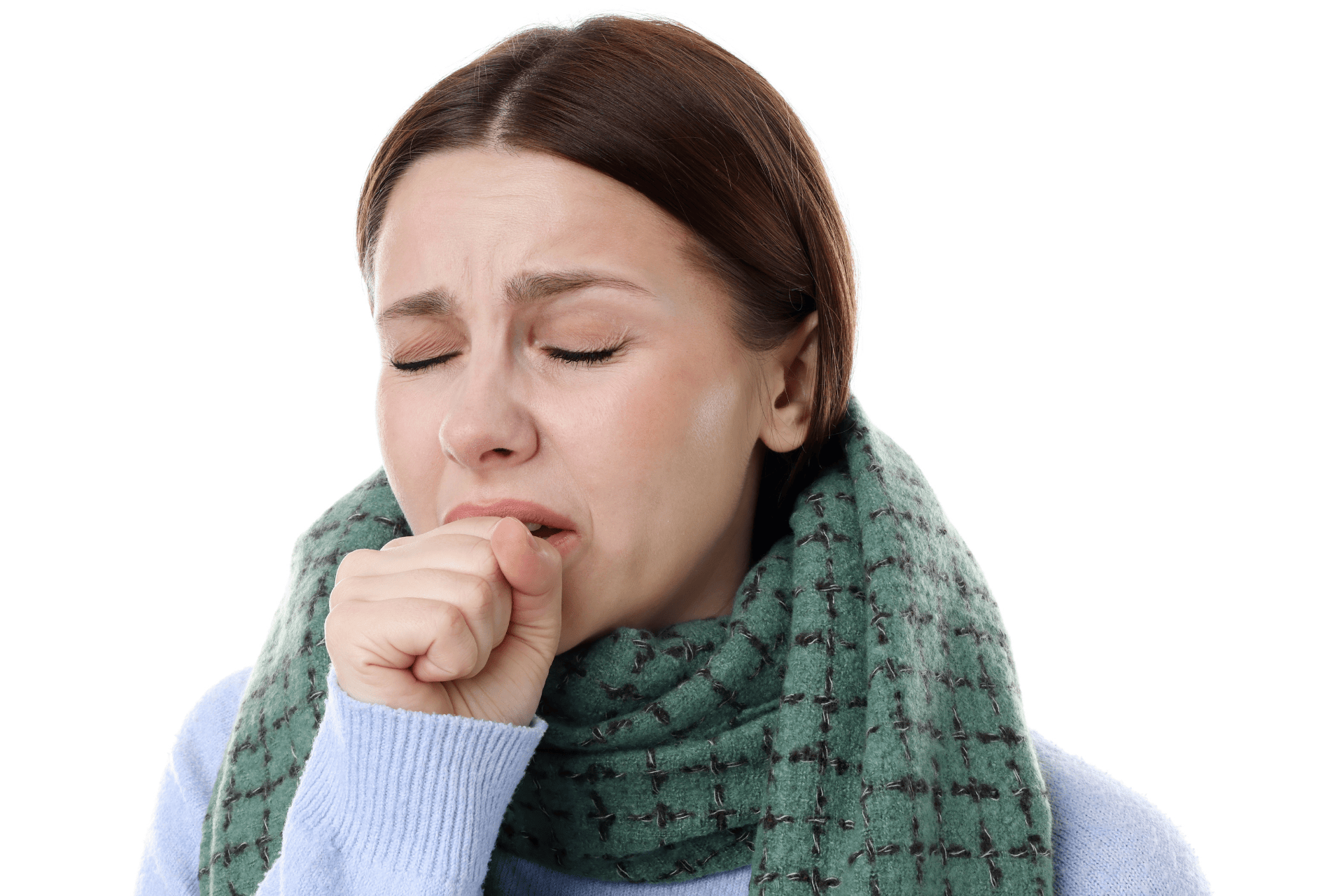 Woman wearing a scarf, coughing into her fist, suggesting a dry cough.