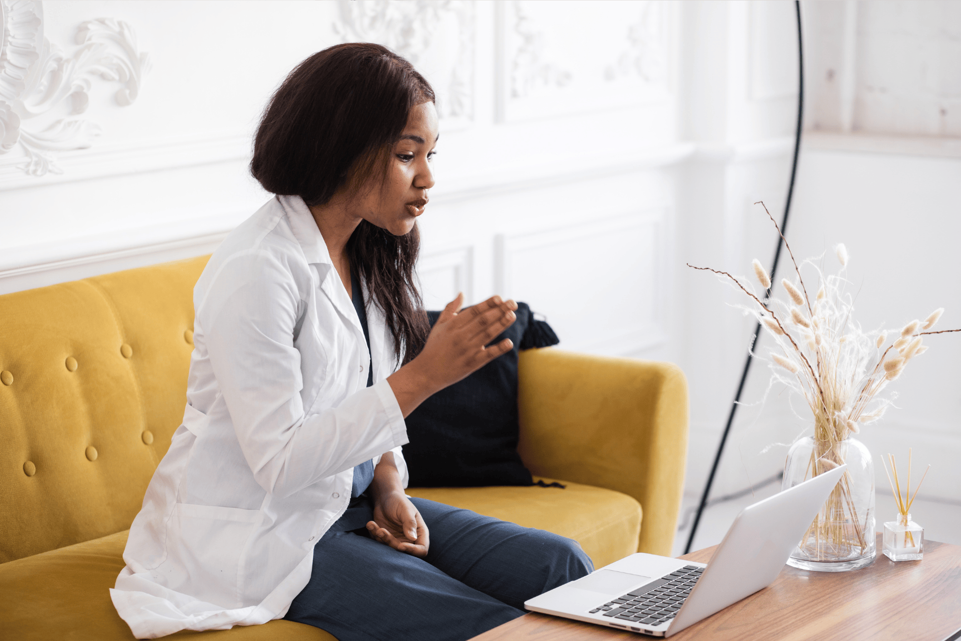 Doctor speaking to a patient during an online video consultation.