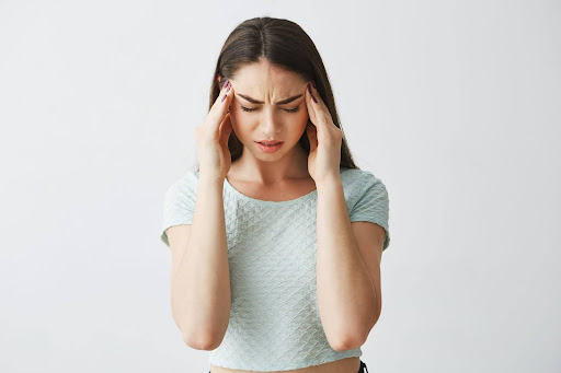 Girl Suffering from a Headache