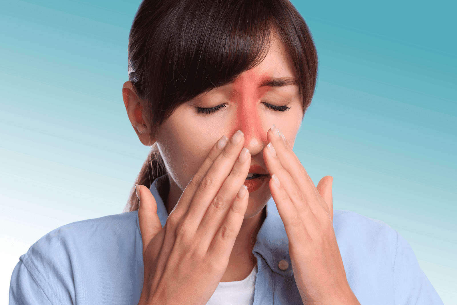 Woman holding her nose bridge with eyes closed, red area indicating sinus pain