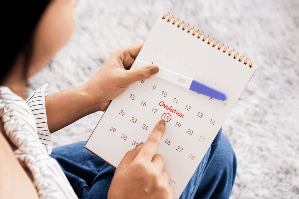 A woman points to the 18th marked as 