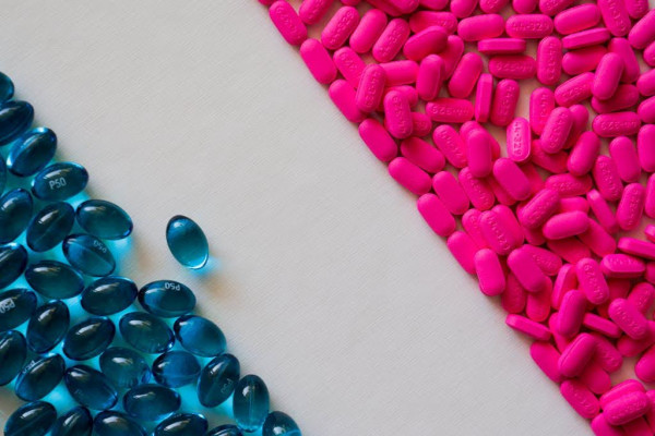 Blue gel capsules and pink pills