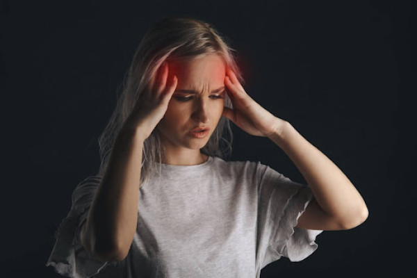Girl Suffering from a Headache